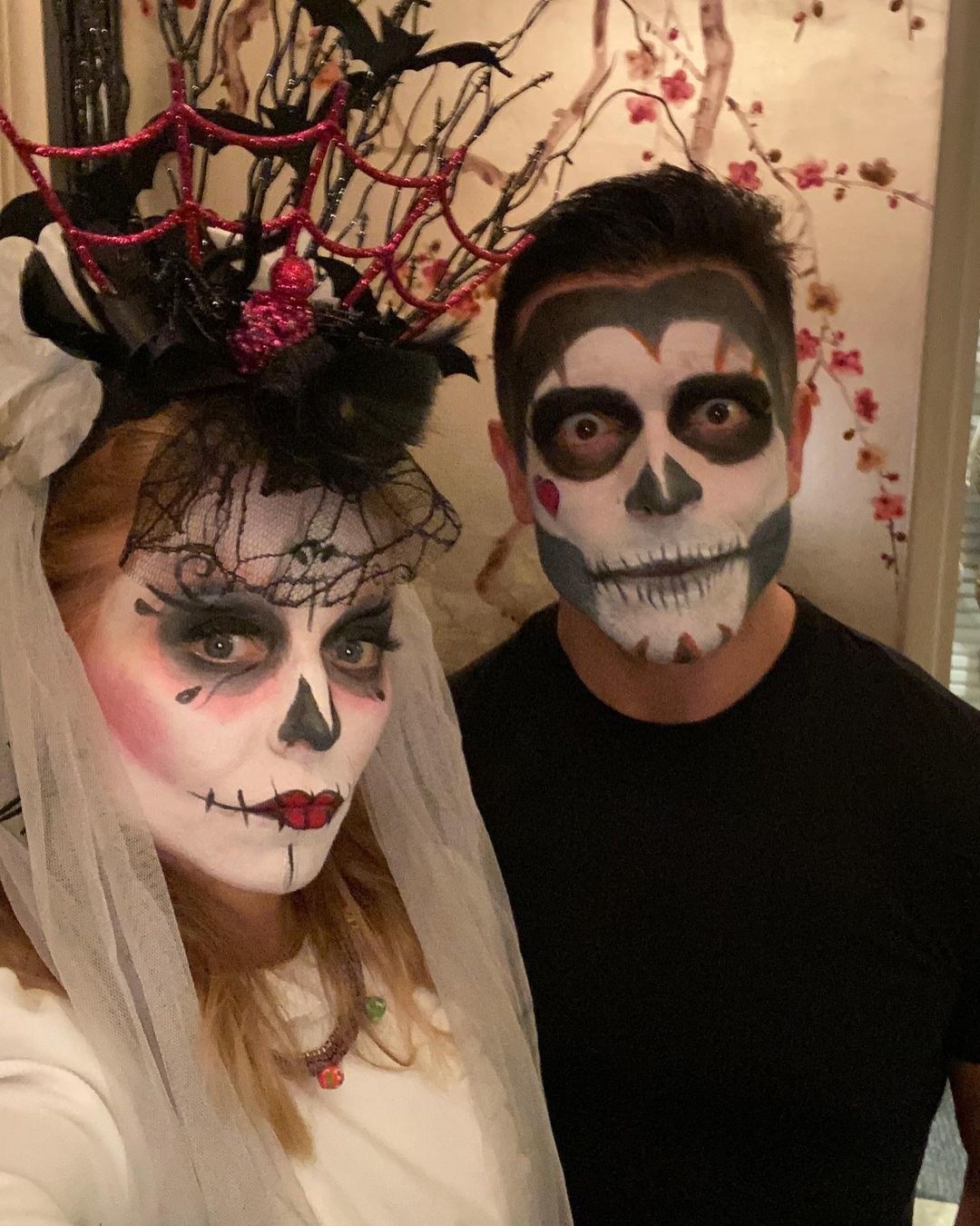 Kelly and Mark dressed as skulls for Halloween