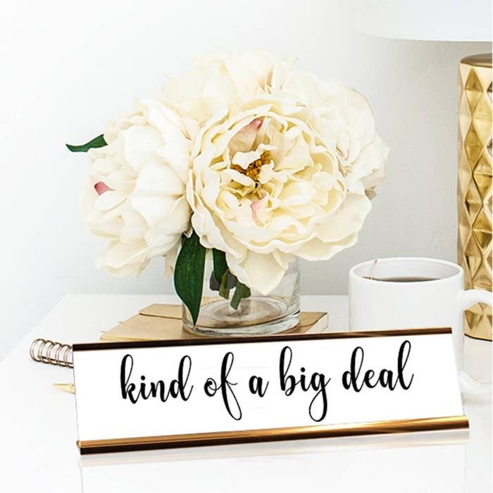 a brass and white desk plate that says &quot;kind of a big deal&quot;
