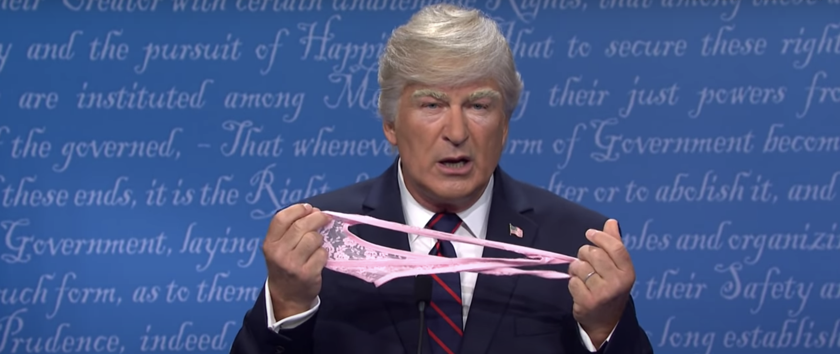 Trump holding up a lace thong