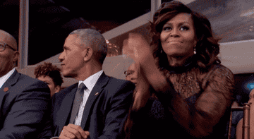Michelle clapping and Barack swaying to the beat