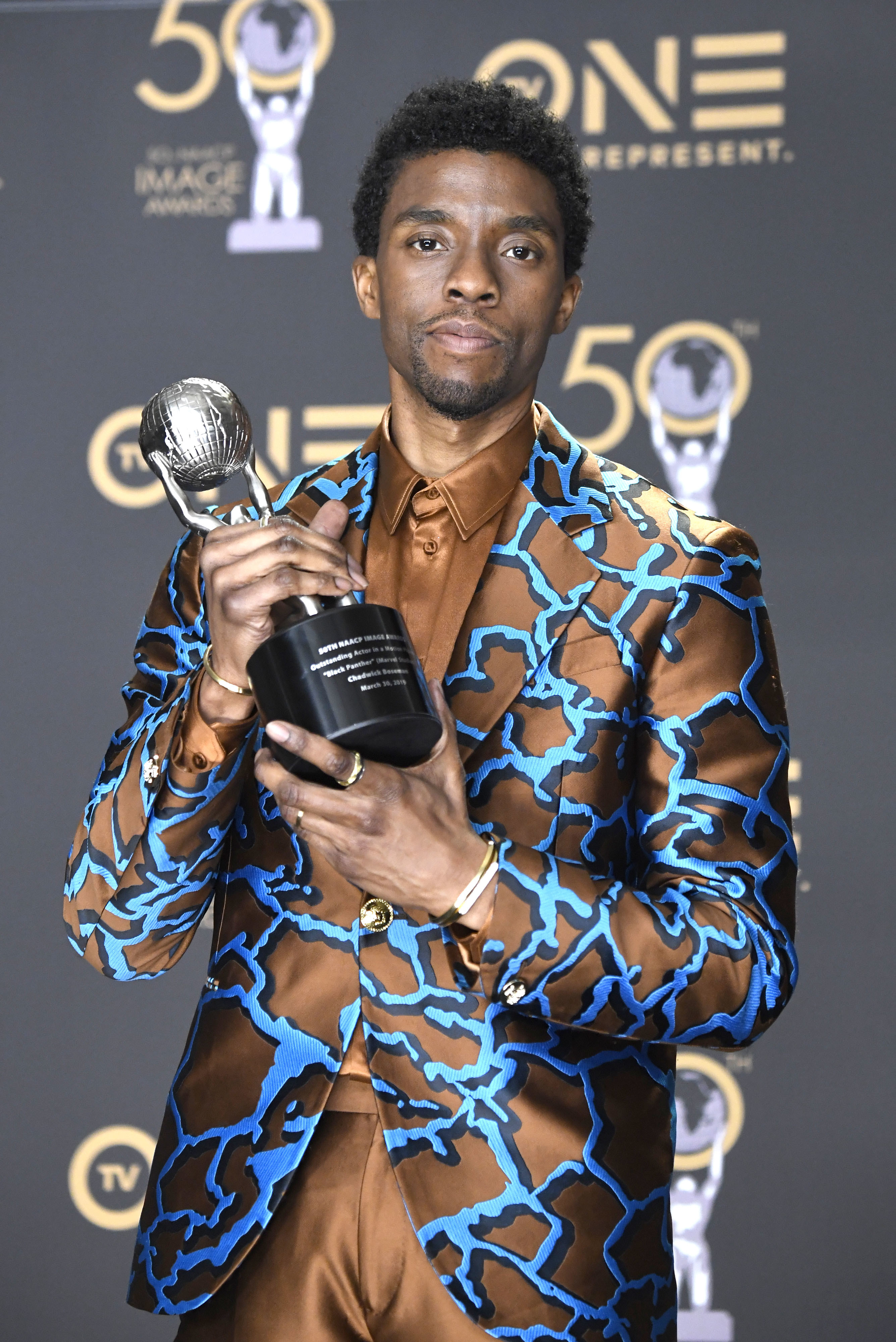 Chadwick holding a NAACP Image Award