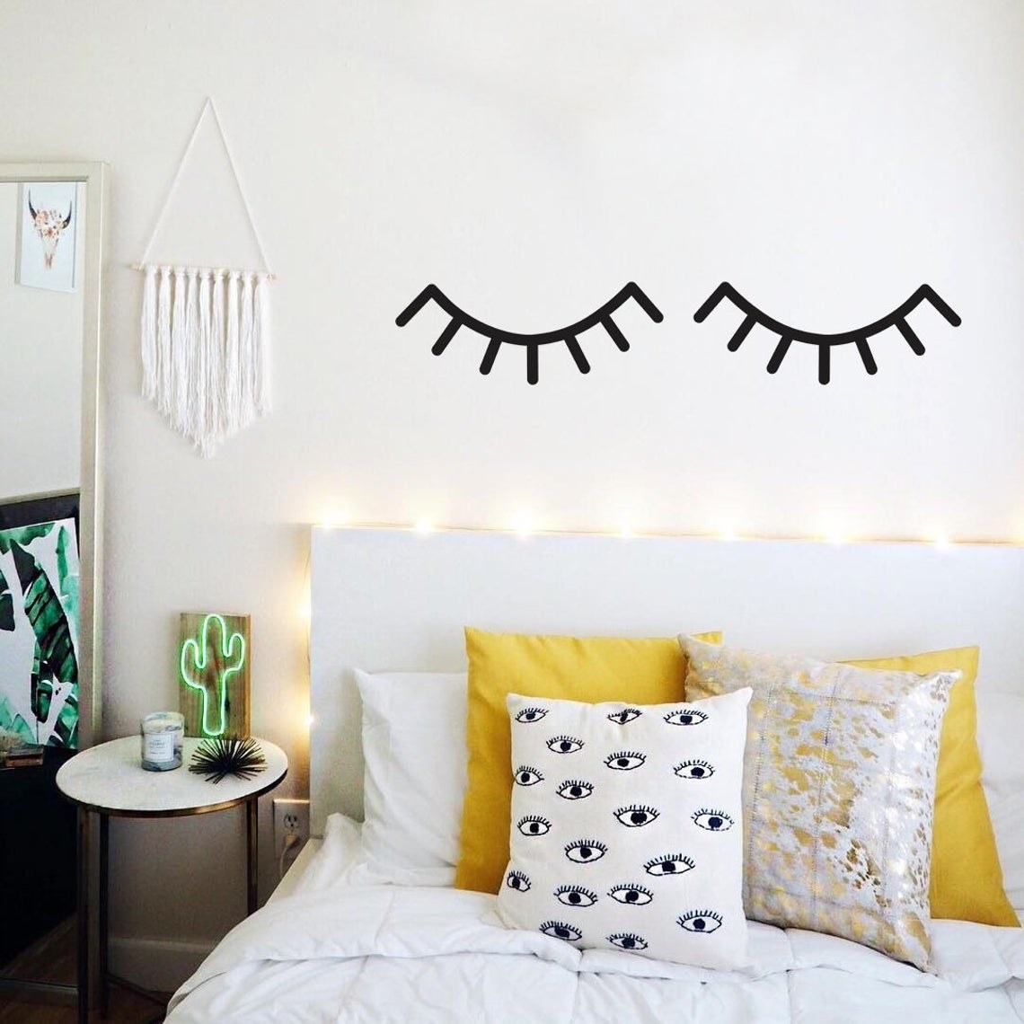 The sleepy eye wall decals above a bed