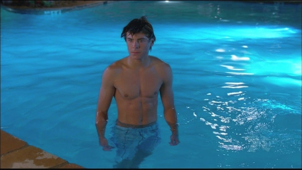 Troy in a pool swimming by himself because he lost all his friends