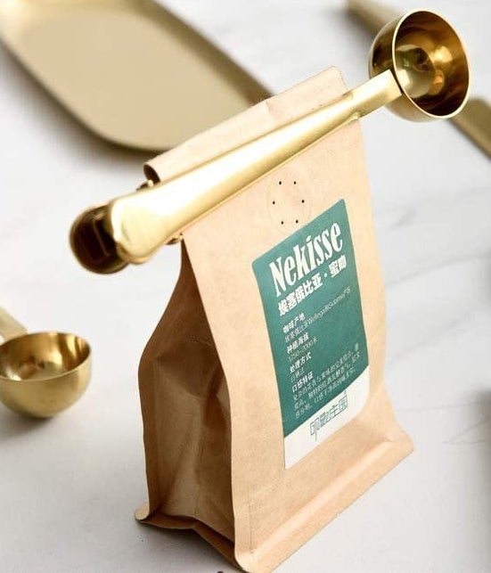 A coffee spoon doubles as a clip to keep a coffee bag closed