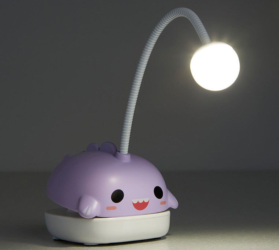 A small clamp with a light attached by a thick flexible wire