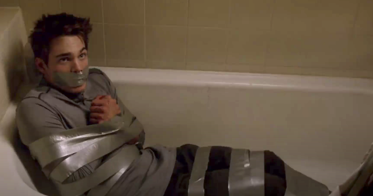 Liam duct taped in the tub