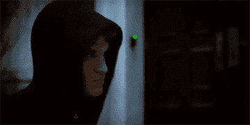a hooded figure turns around, revealing himself to be Toby