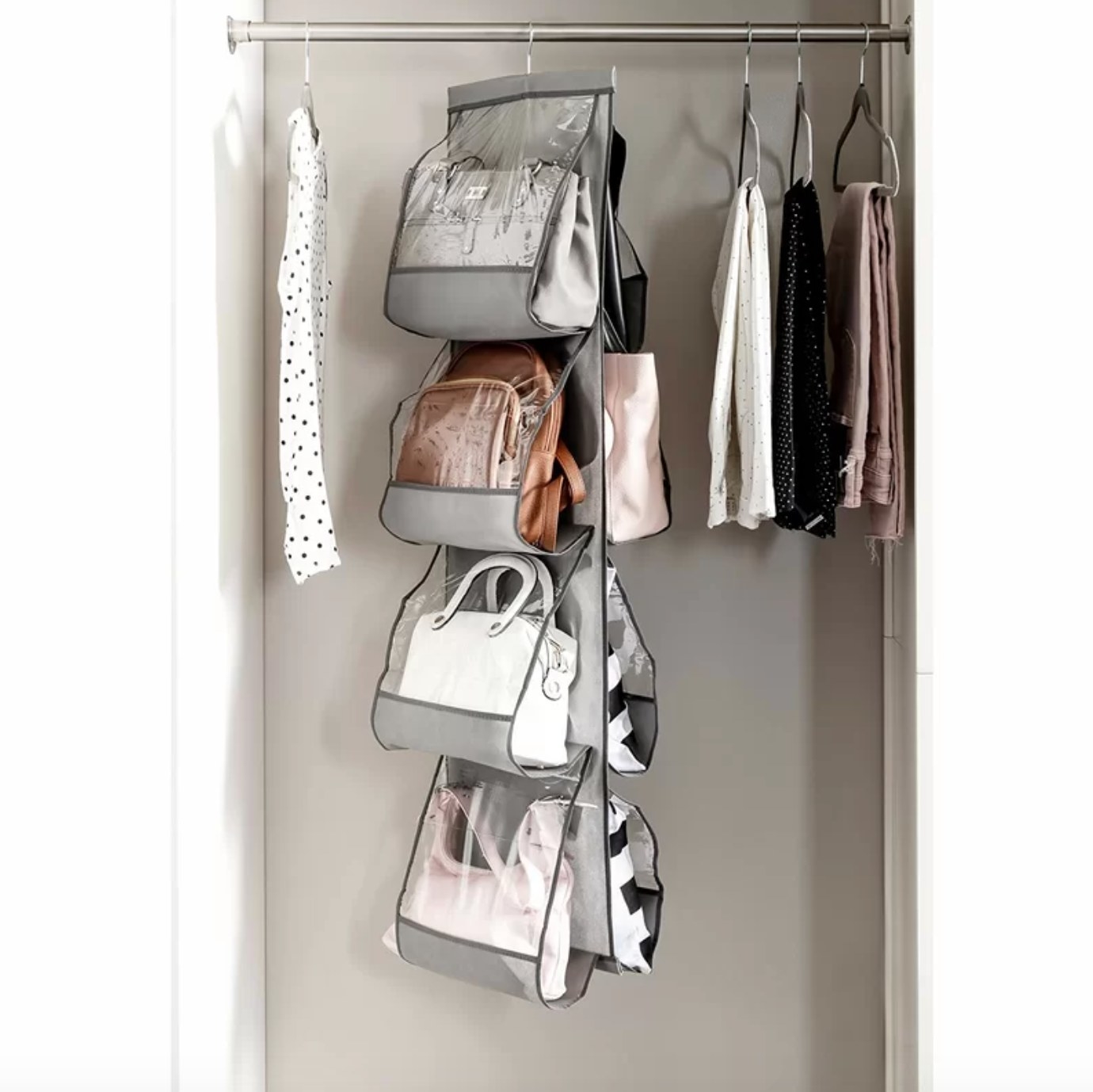 The handbag organizer hanging in a closet