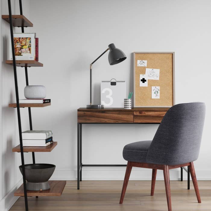 wooden desk with black metal legs in a home office