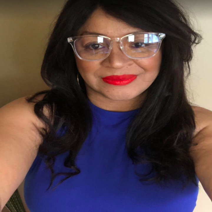 A reviewer wearing the transparent glasses