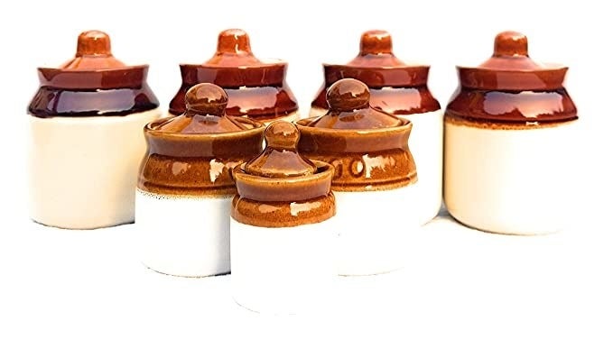 Brown and white ceramic mini jars.