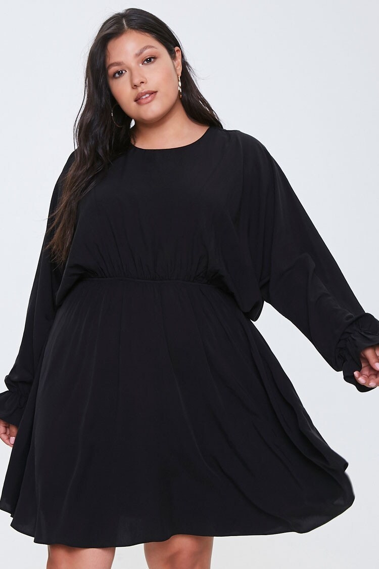 Loose black long sleeve dress with cinched waist 