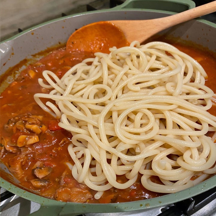 Cooked bucatini in the mushroom Bolognese.