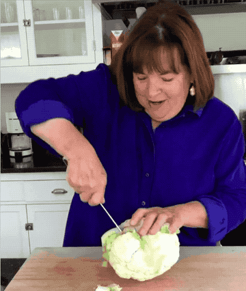 Ina Garten slicing a cauliflower.