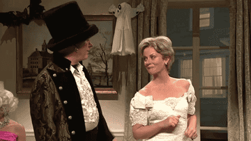 a gif of snl&#x27;s portrayal of bill and hilary clinton on halloween