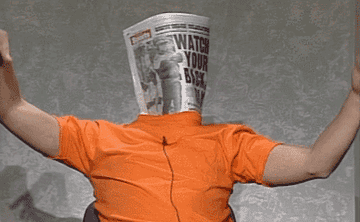 a gif of adam sandler waving his arms around with a newspaper over his head