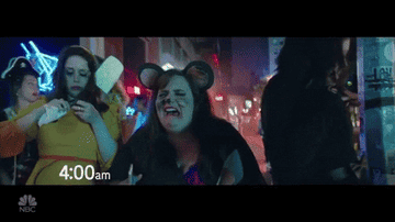 a gif of aidy bryant dressed as a drunk mouse crying