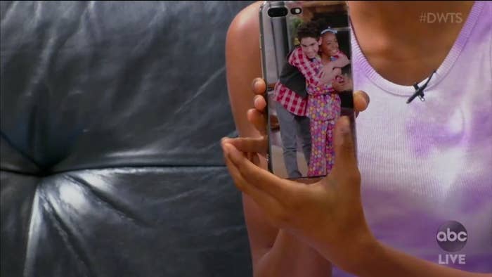 Skai showing a picture of herself and Cameron on her phone case