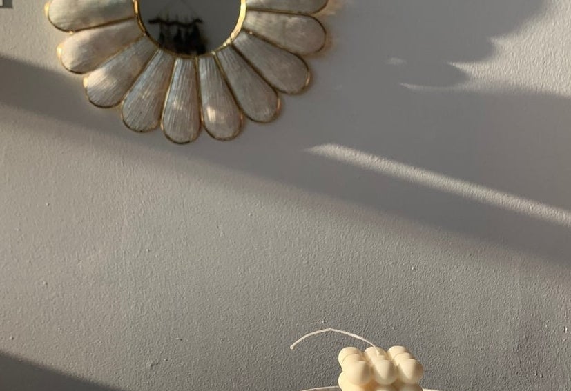 square candle with nine bubbles on each side 