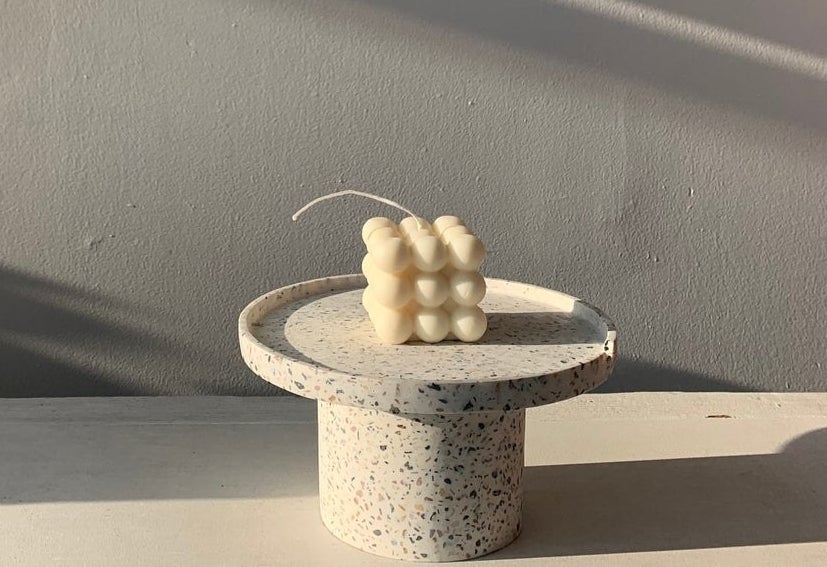 square candle with nine bubbles on each side 