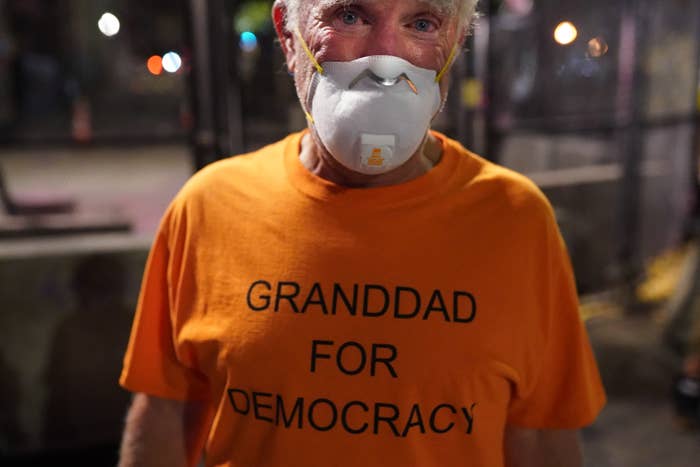 An older man wearing a face mask