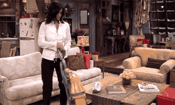Monica from Friends vacuuming 