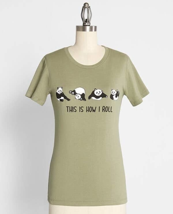 The light green tee with the text &quot;this is how I roll&quot; printed on it and four different graphics of a panda rolling around printed on it