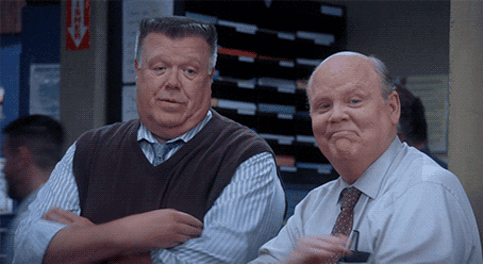 A gif of Hitchcock and Scully from Brooklyn Nine-Nine high-fiving