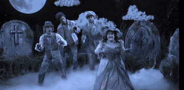 a gif of chance, aidy, kenan, mikey day dancing as ghosts