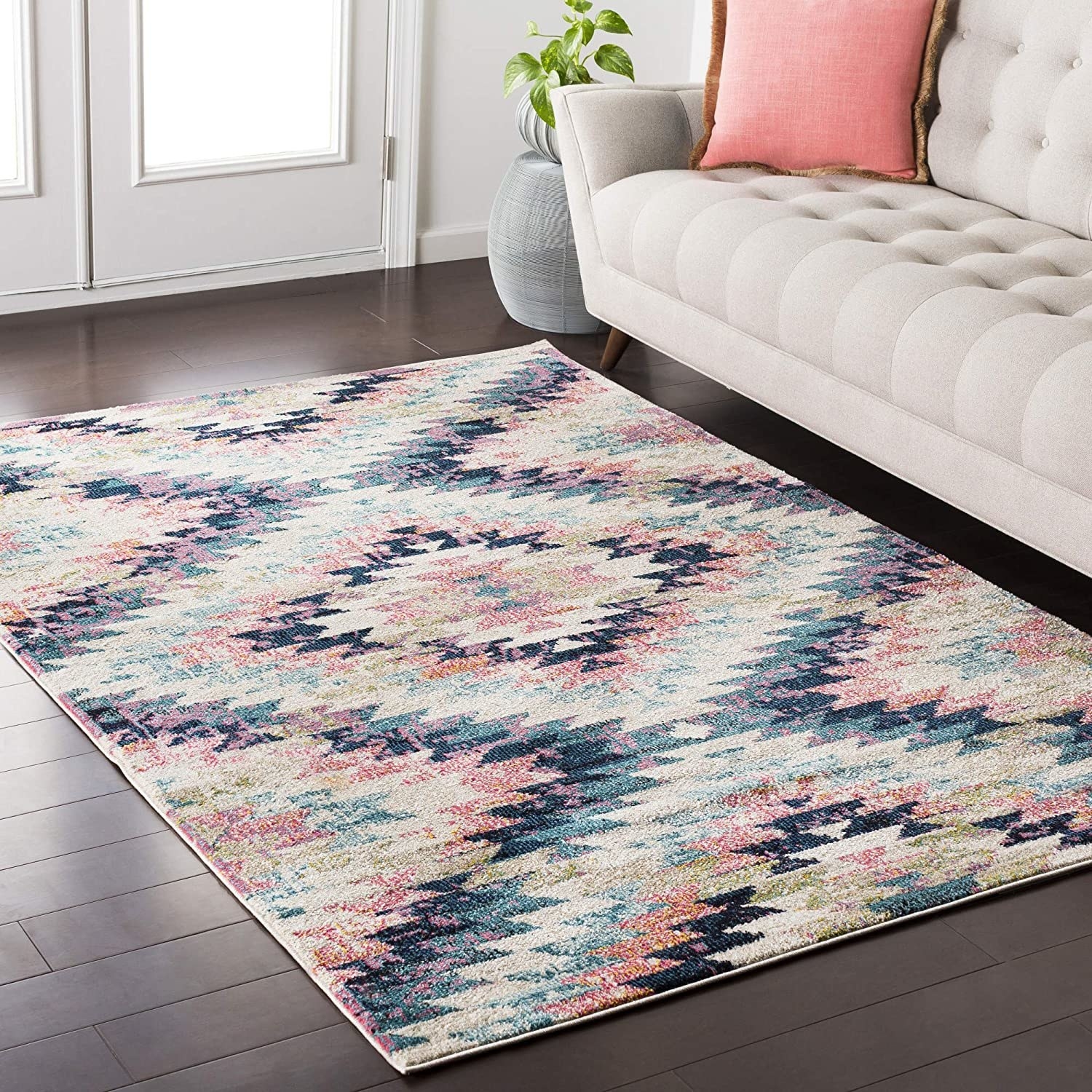 The pink, beige, and blue bohemian-style geometric rug