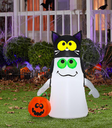 A friendly looking inflatable ghost has on a cat hat