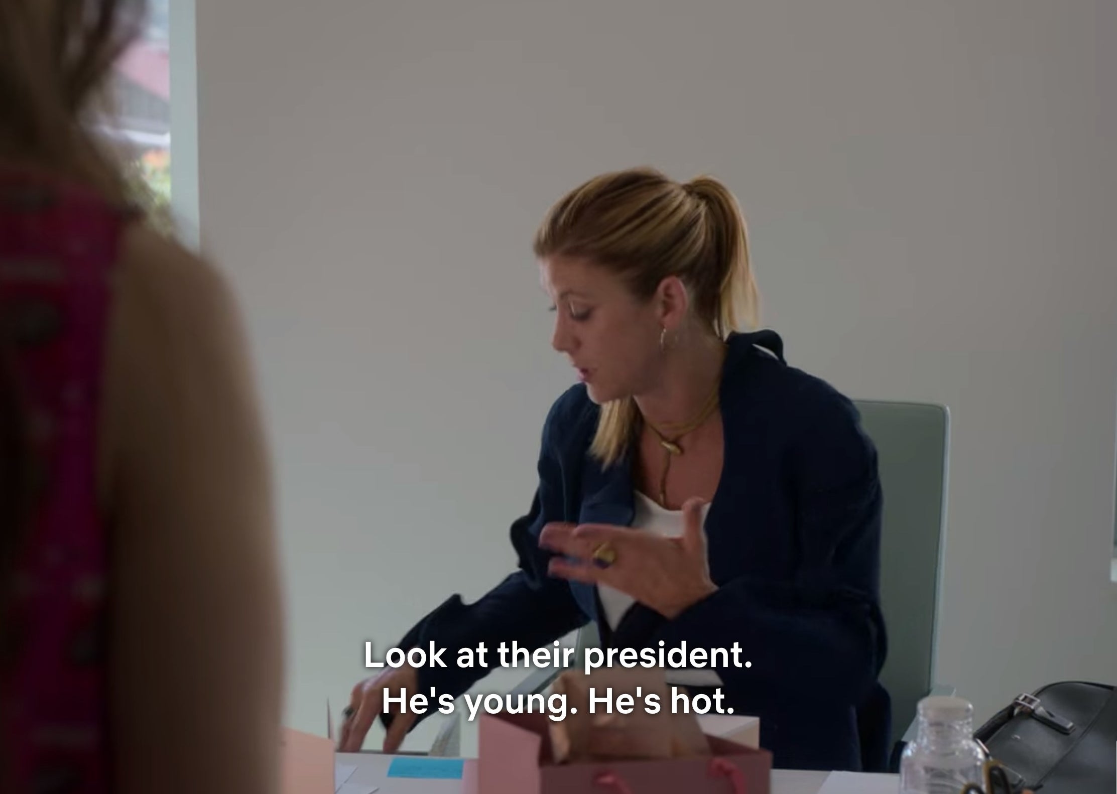 A scene from &quot;Emily in Paris&quot; that says &quot;Look at their president [Emmanuel Macron]. He&#x27;s young. He&#x27;s hot.&quot;