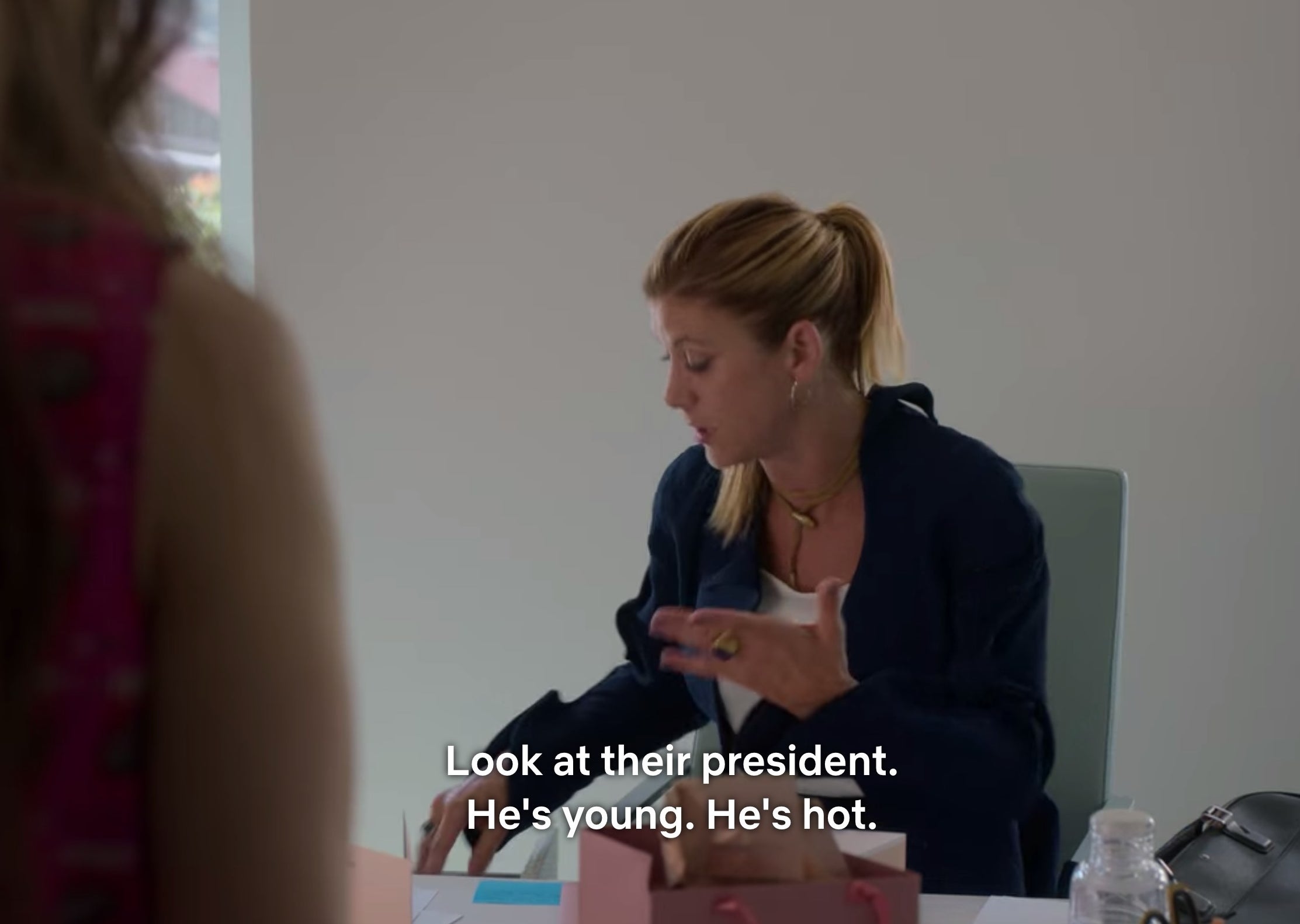 A scene from &quot;Emily in Paris&quot; that says &quot;Look at their president [Emmanuel Macron]. He&#x27;s young. He&#x27;s hot.&quot;