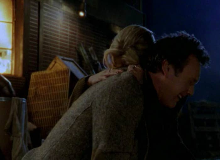 Giles sobs in Buffy's arms