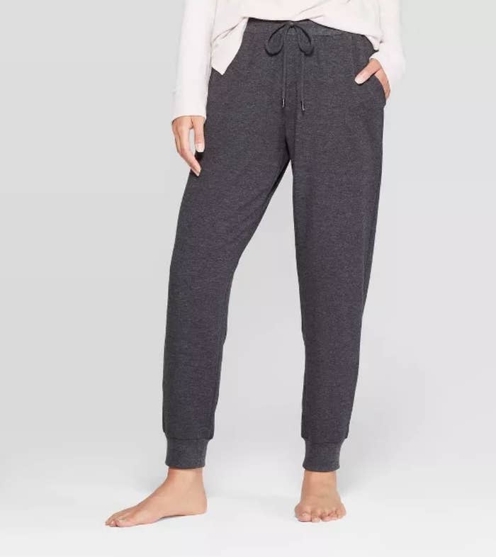 Model wearing charcoal gray jogger sweatpants