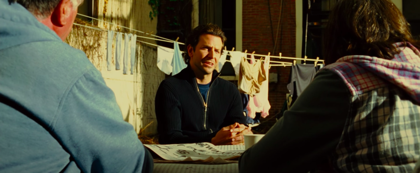 Bradley Cooper in a zipped up sweater and a t-shirt