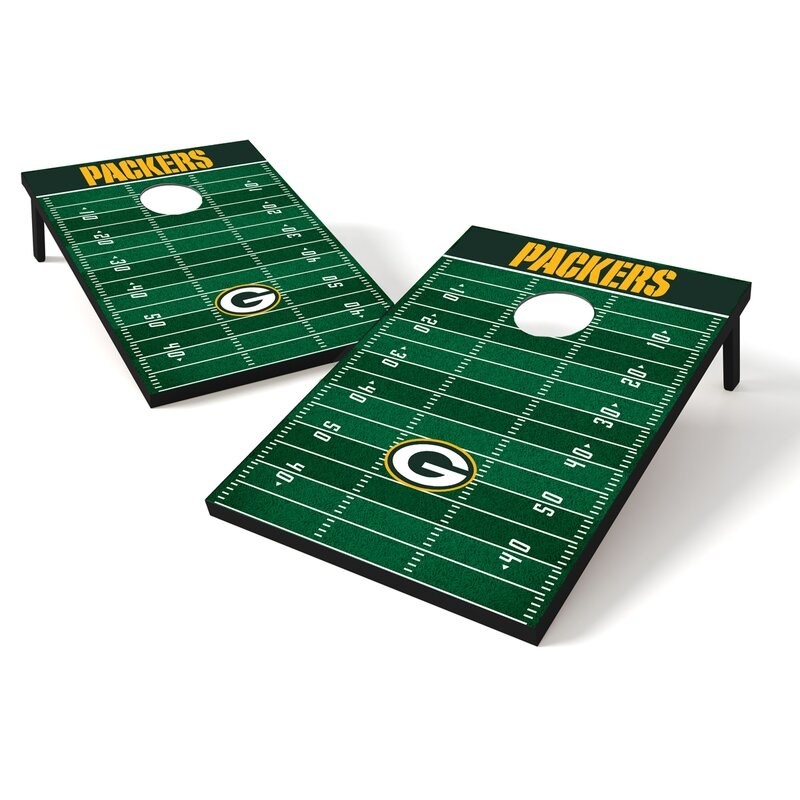 A cornhole game set with a Green Bay Packers football design