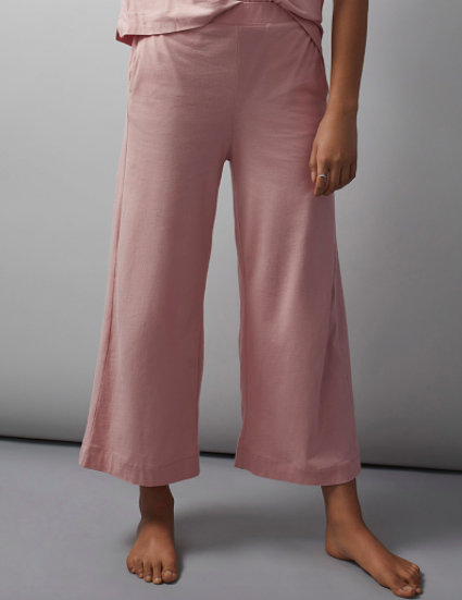 A close up of a model wearing the flared loungewear pants