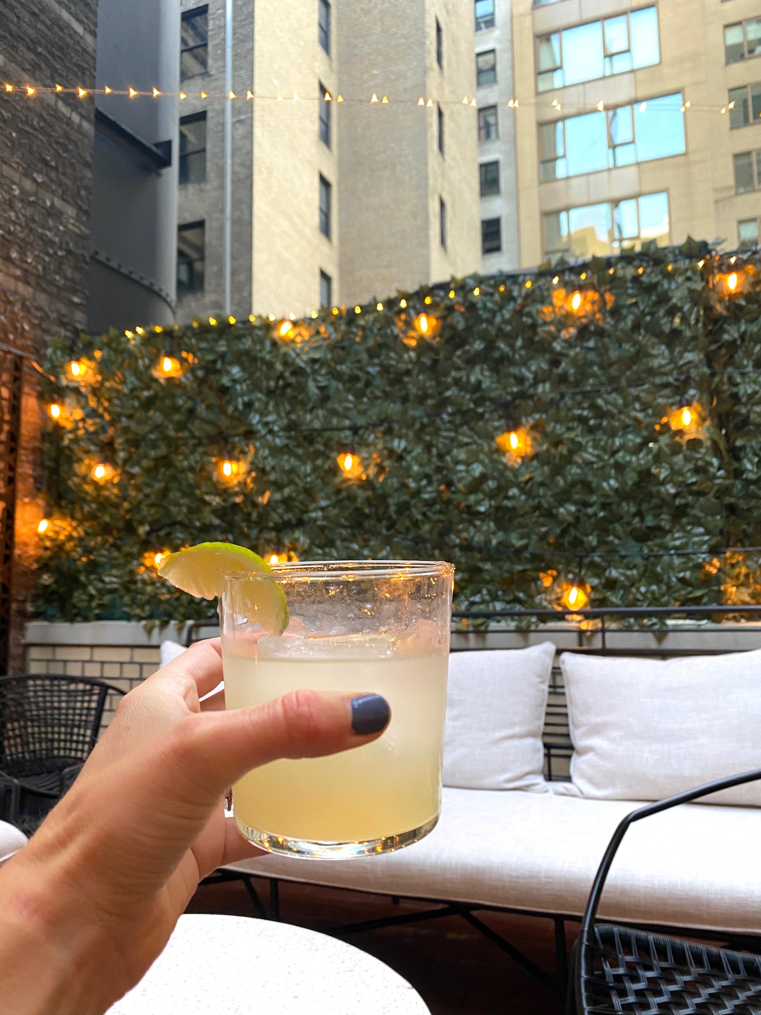 Me holding a Margarita outdoors.