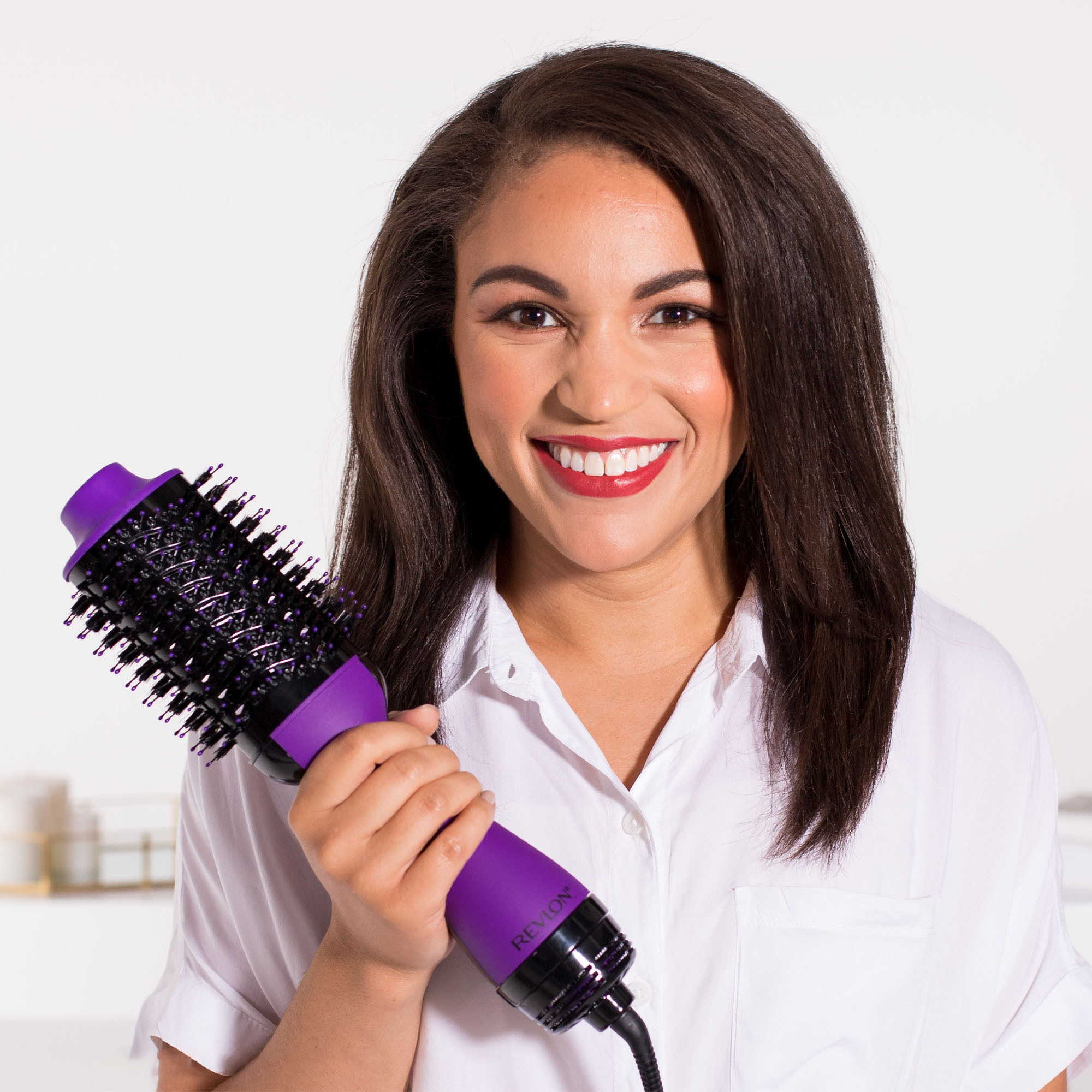 Model holding the dryer brush