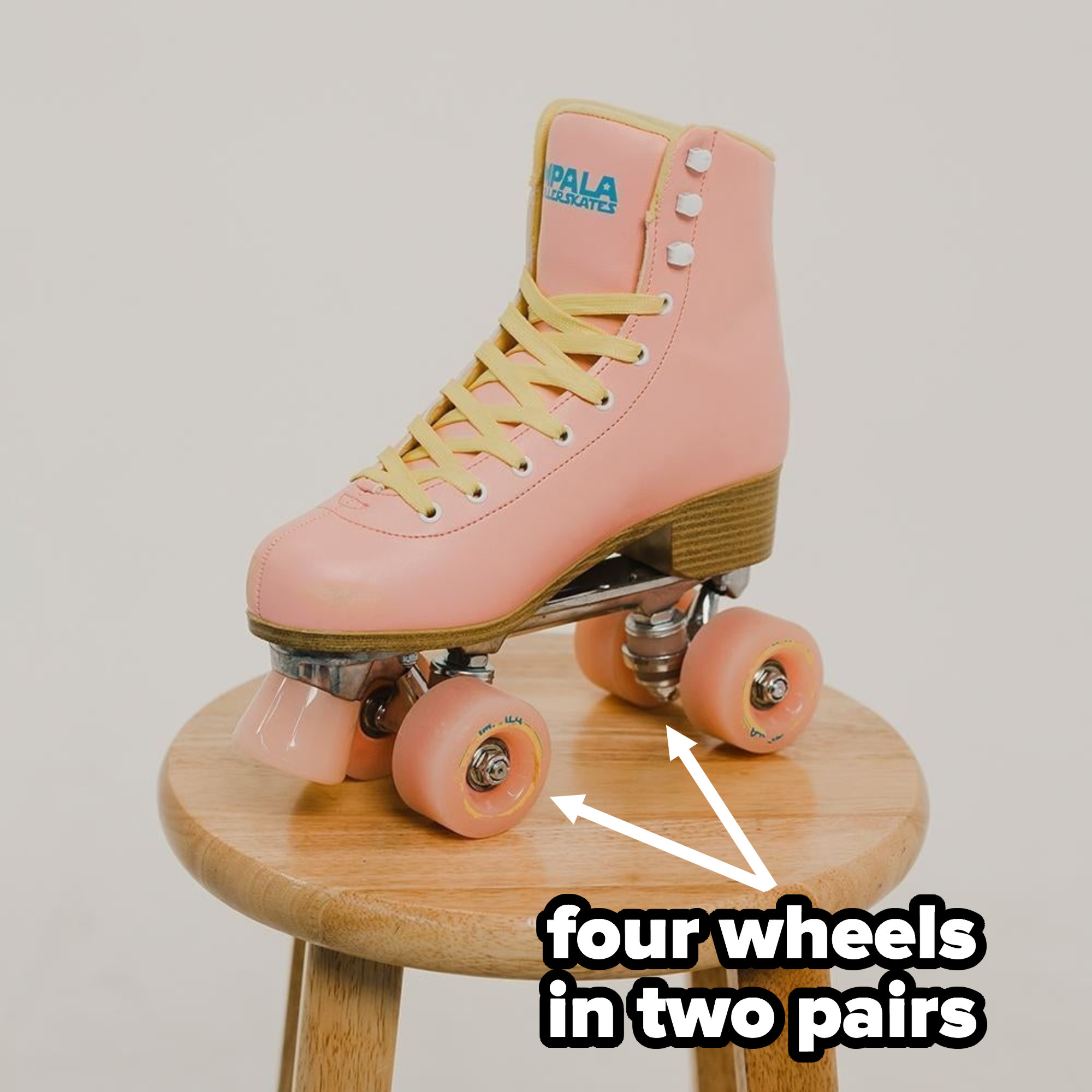 A roller skate with a toe stop sits on a stool