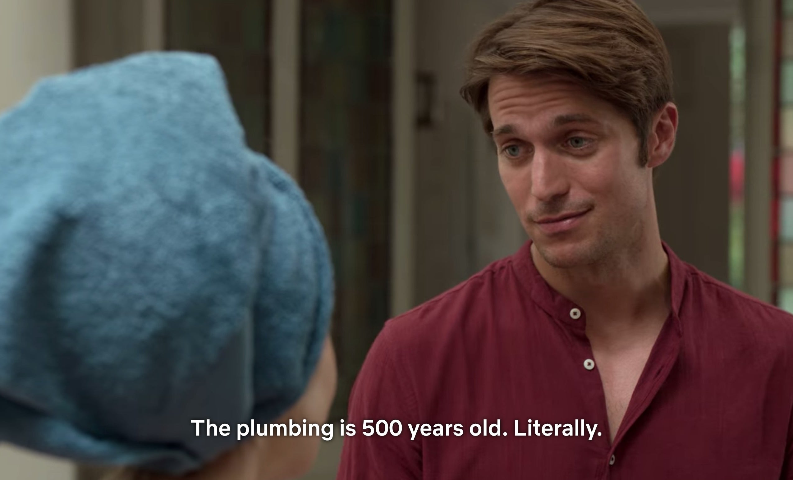 A scene from Emily in Paris that says &quot;The plumbing in 500 years old. Literally.&quot;