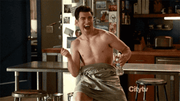 Schmidt from &quot;New Girl&quot; wrapped in a bed sheet and dancing