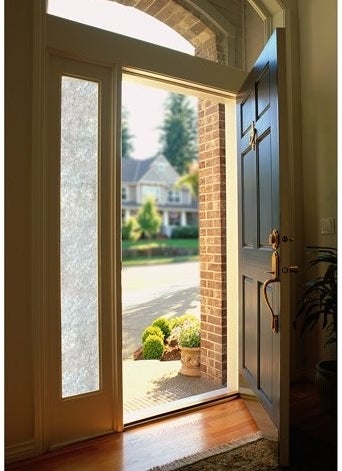 the film on a vertical window next to a door