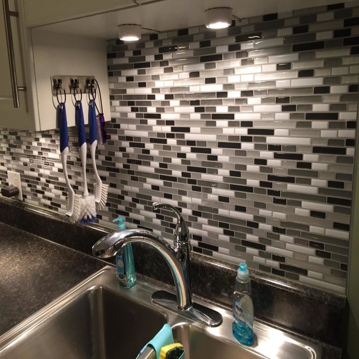 The tiles applied into a backsplash area on a kitchen sink
