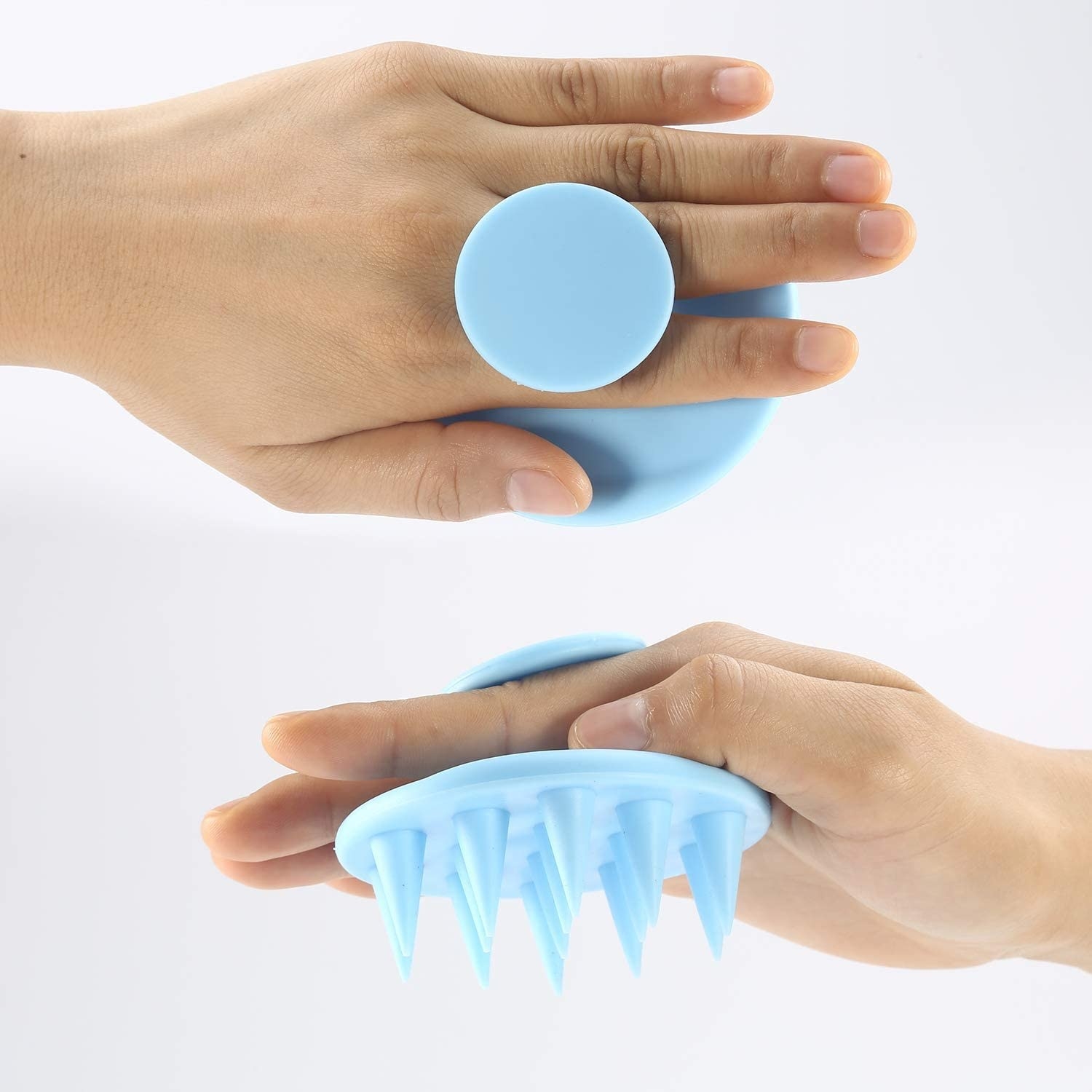 A person holding the shampoo brush