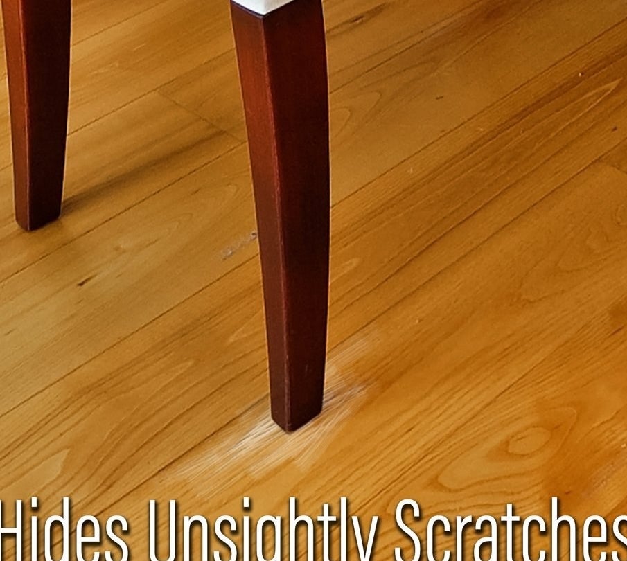 A wooden floor with scratches from scraping chair legs