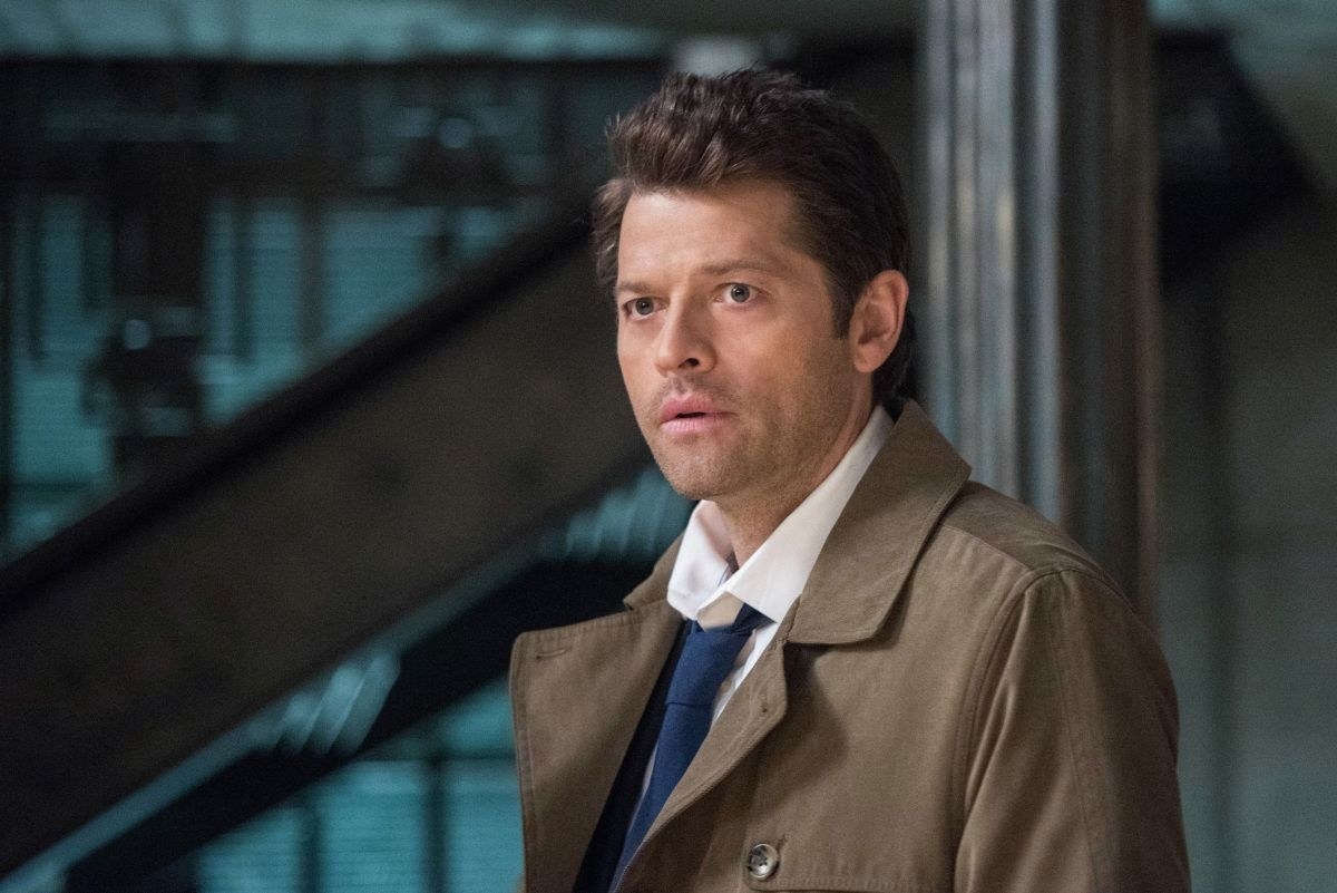 A closeup of Castiel, who is wearing a jacket, white shirt and tie