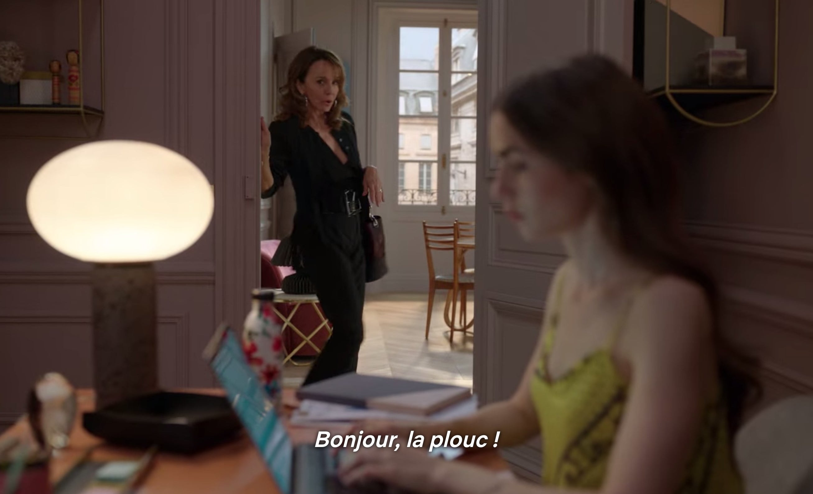 Emily being greeted at her new job with "Bonjour, la plouc!"