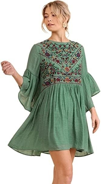 model wearing the dress in green